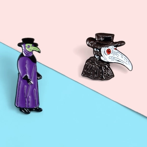 Detail of purple and black-white Plague Doctor enamel pins on a split background
