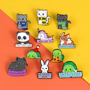 Enamel lapel pins featuring cute cartoon animals with social quote tags on orange background