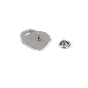 Detail of silver metal brooch back with pin base and separate butterfly clutch fastener