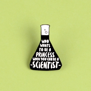 Black and white flask enamel pin with scientific quote on a mint green background