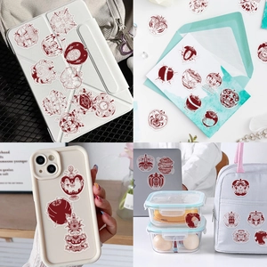 Gothic red apple PET stickers shown on phone case and laptop for decoration
