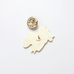 Detailed back view of a gold-plated artistic brooch with metal butterfly clasp and pin