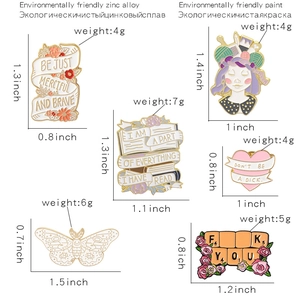 Detailed view of six colorful enamel lapel pins with motivational and artistic themes