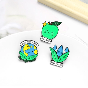 Three-piece eco-friendly enamel pin set featuring go green apple and save the earth earth leaf