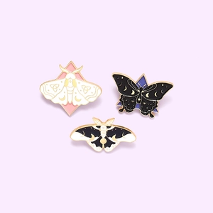 Three-piece enamel moth and butterfly brooch set with celestial lunar star patterns