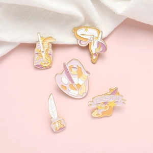 Five-piece creative artist enamel pin set with palette brushes and dream motif