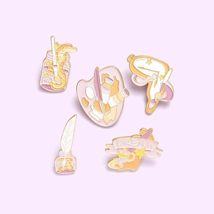 Five-piece artistic enamel pin set featuring paint palette brush and Dream star badges