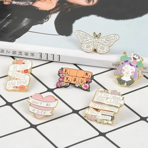 Set of six colorful enamel pins featuring butterfly, heart, and girl motifs on white background