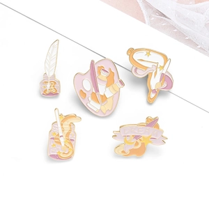 Five-piece artistic enamel pin set featuring palette and ink bottle in pink and gold