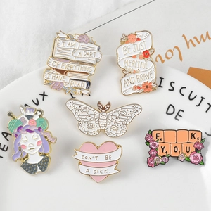 Set of cartoon enamel pins with inspirational quotes and floral girls for clothing