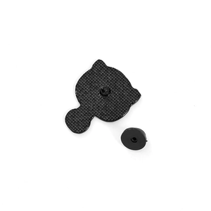 Detail view of black enamel pin back with non-slip texture and rubber clutch