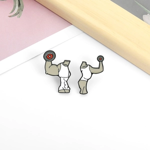 Cartoon couple weightlifting enamel pins set featuring fitness male and female bodies