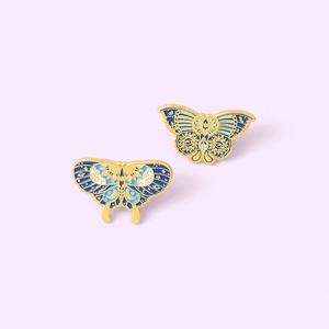 Detailed blue enamel butterfly brooches with mystical eye and star patterns in gold plating
