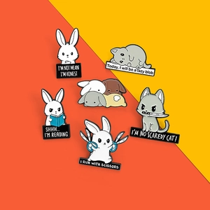 Collection of creative cartoon enamel pins featuring cute animals and humorous English phrases
