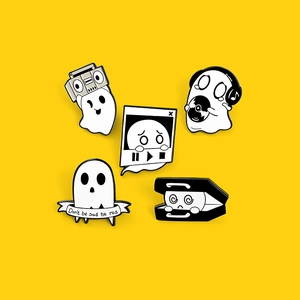 Set of five cute cartoon ghost enamel pins with music and retro themes on yellow backdrop