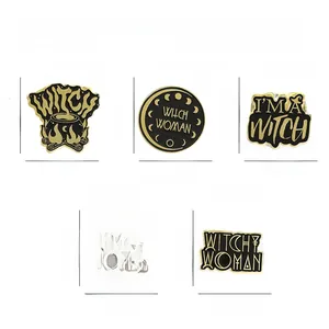 Detailed view of black and gold witch enamel pins with dimensions and weight specs
