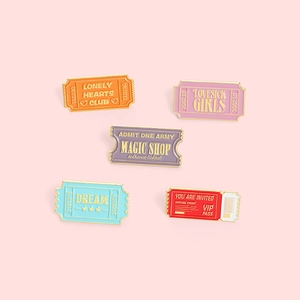 Retro ticket style enamel pin set featuring Magic Shop and Lovesick Girls designs