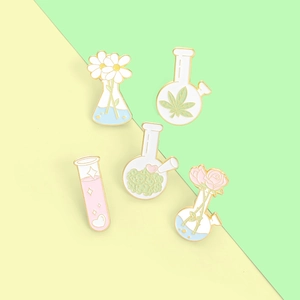 Detailed set of cartoon pink test tubes and floral lab flask enamel lapel pins