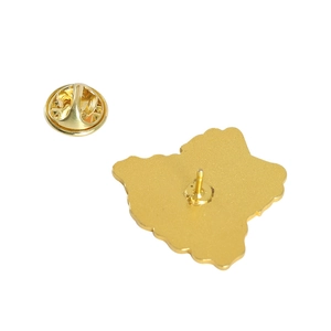 Detail of metal pin base with butterfly clutch backing in a polished gold finish
