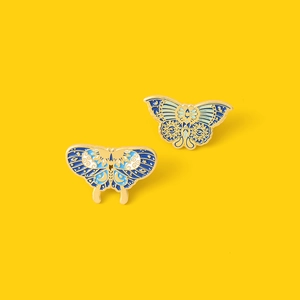 Artistic butterfly enamel brooches with celestial moon and star motifs on gold plating