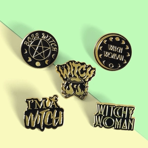 Detail of five-piece witch-themed enamel pins featuring star and moon designs on alloy