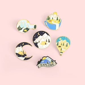 Set of 6 outdoor camping enamel pins with mountains and tents on pink background