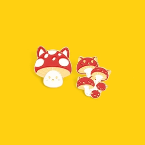 Cute cartoon cat mushroom enamel pins set with red spotted caps on bright yellow backdrop