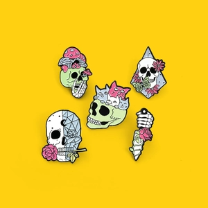 Gothic skull enamel pin set with mushrooms, cats, and roses on a yellow background