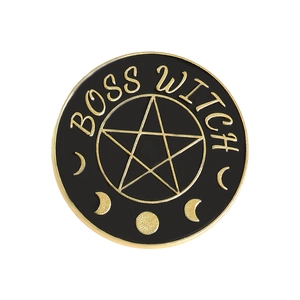 Detailed view of Boss Witch enamel pin with gold celestial moon phases and star design