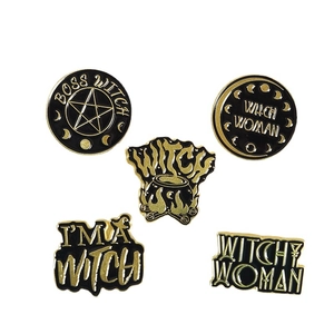Five-piece set of black and gold witch enamel pins featuring stars and moon designs