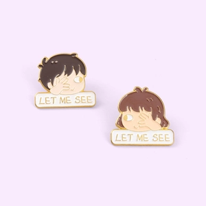 Minimalist enamel couple pins featuring cartoon figures and LET ME SEE text design