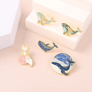 Cute cartoon whale and fox enamel pins set with colorful gradients and gold metal edges