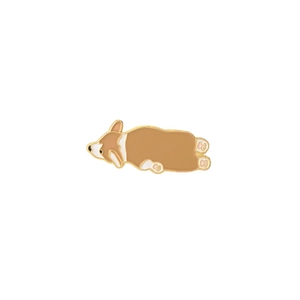 Detail of cute corgi enamel pin with yellow and white metal finish for clothing
