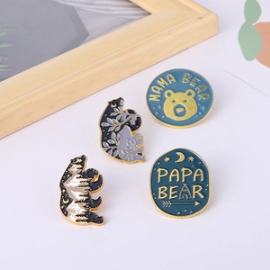 Set of four cartoon polar bear enamel pins with Mama Bear and Papa Bear letter designs