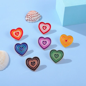 Colorful Y2K heart-shaped enamel pin set with gradient tones and gold metallic finish