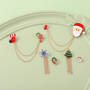 Set creativo di spille smaltate natalizie con Babbo Natale e fiocchi di neve