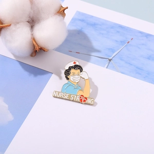 Nurse Strong enamel pin brooch featuring nurse power design with heart detail