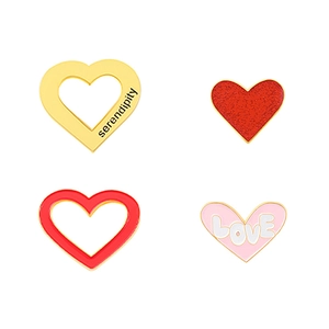 Set of four unique heart-shaped metal pins featuring serendipity and love designs