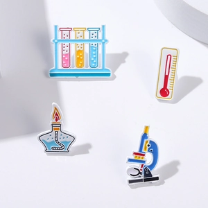 Enamel pins set with microscope thermometer test tube and alcohol lamp for science