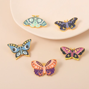 Exquisite butterfly and moth enamel pin set with celestial moon and star designs