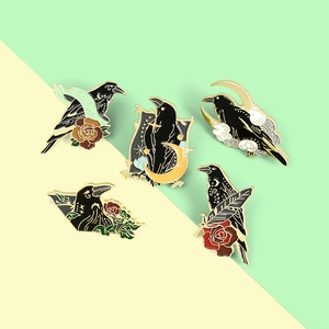 Set of five gothic crow enamel pins with red roses, crescent moon and Solitude text details