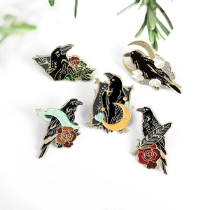 Set of 5 raven enamel pins with moon and star designs in creative black and gold alloy