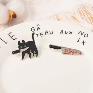 Cartoon black cat with knife enamel pin set featuring killing it design on white plate