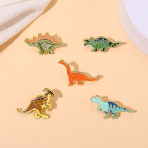 Lot de 5 broches dinosaures colorées en émail et alliage de zinc avec bordures dorées