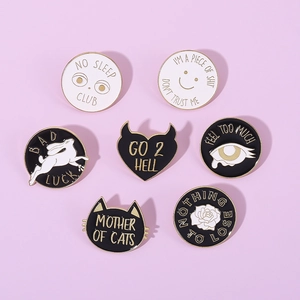 7-piece set of round rabbit and cat enamel pins with creative English letter designs