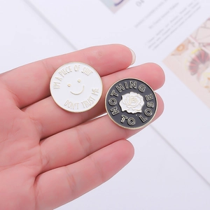 Round enamel brooch pins with rose and smiley face patterns in black and white finish