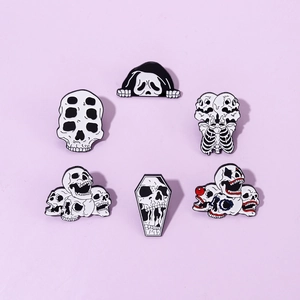 Detailed macro view of 6-piece skull enamel pins set with spooky punk aesthetics