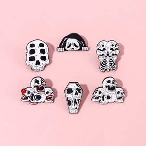 Set of six punk horror skull enamel pins featuring intricate black and white metal details