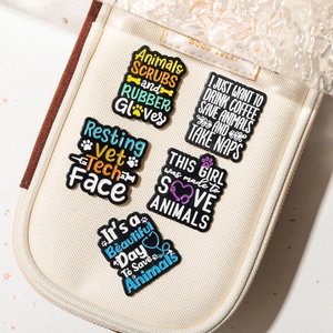 5-piece colorful enamel Vet Tech brooch pin set displayed in an off-white zipper pouch