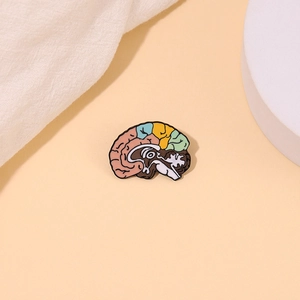 Colorful human brain enamel pin with anatomical sections on a minimalist light background